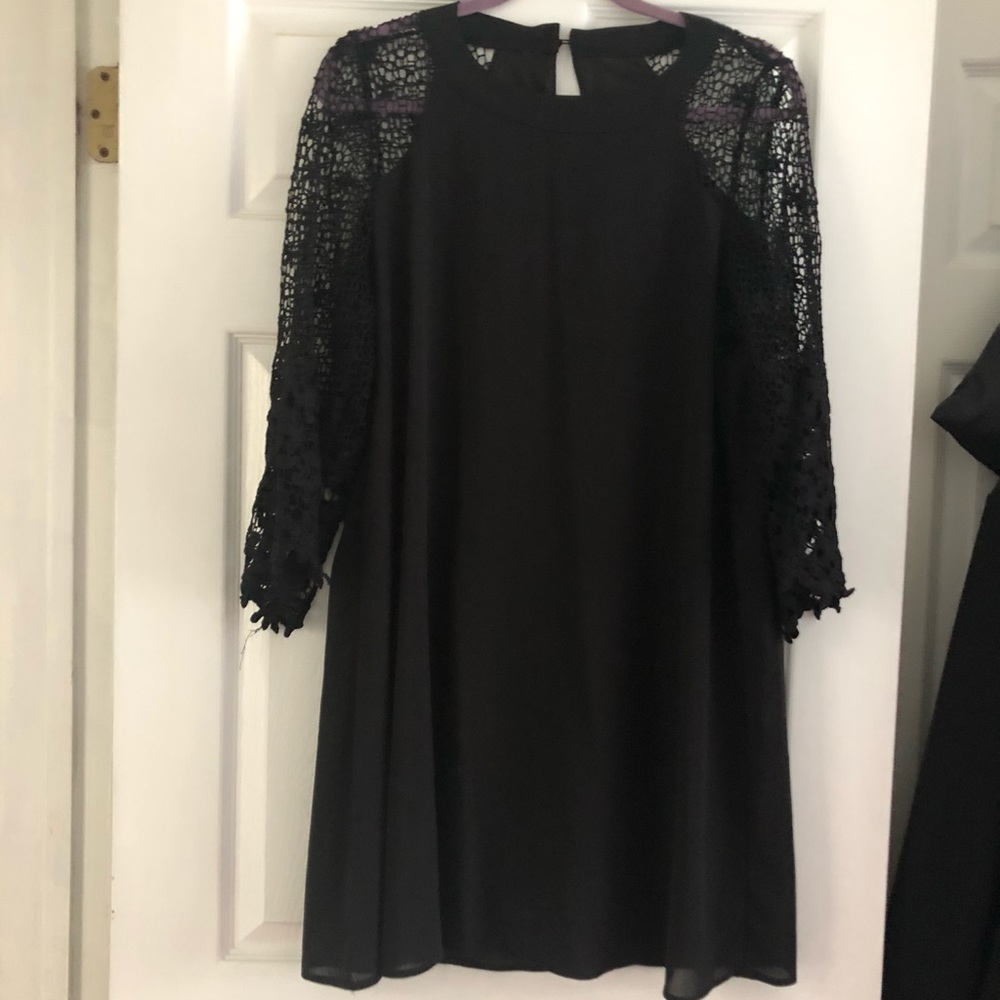 Black mini dress with crocheted sleeves